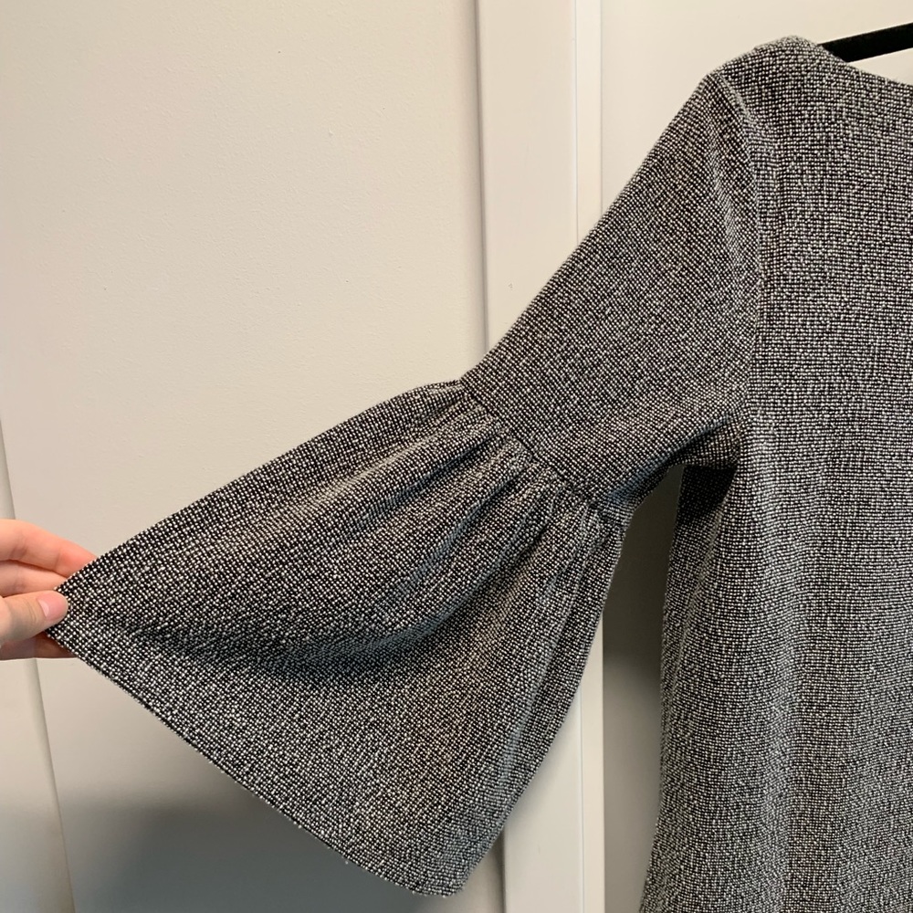 Banana Republic black textured peplum sleeve top.